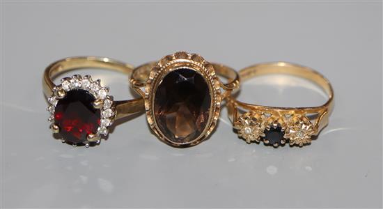 Three assorted 9ct gold and gem set dress rings.